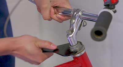 Using a headset wrench on a bike