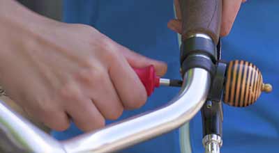 Using a Phillips head wrench on a bike